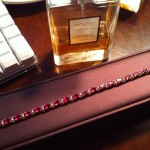 Diamond and Ruby Bracelet with Bottle of Coco Chanel Mademoiselle Perfume