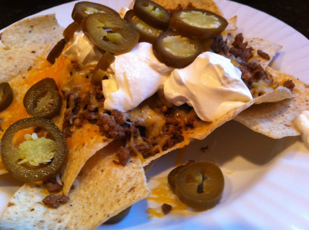 Nachos with Jalapenos, Cheese, Beef, Sour Creme, and Tortilla Chips Nachos with Jalapenos, Cheese, Beef, Sour Creme, and Tortilla Chips