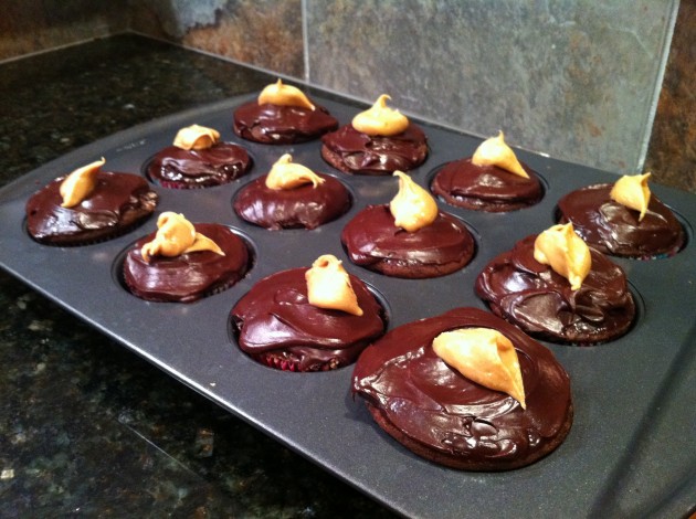 Peanut Butter Piped Into Chocolate Cupcakes