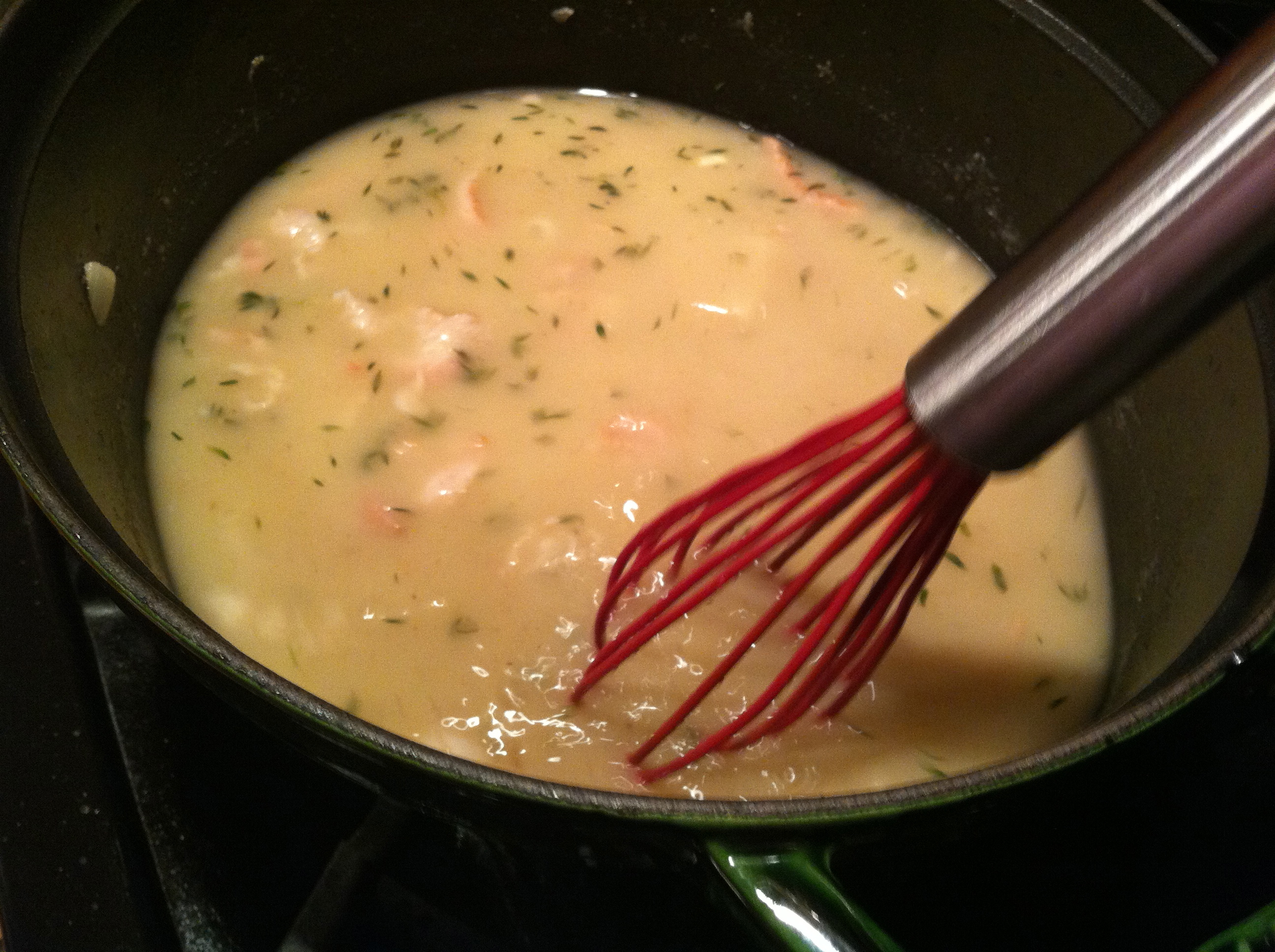 Whisking the Corn Chowder After Adding the Water