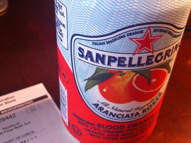 Orange San Pellegrino and Dividend Checks