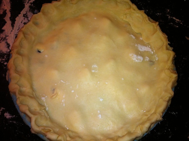Putting on the Top Layer of Cherry Pie Before Smoothing and Fixing the Edges Putting on the Top Layer of Cherry Pie Before Smoothing and Fixing the Edges