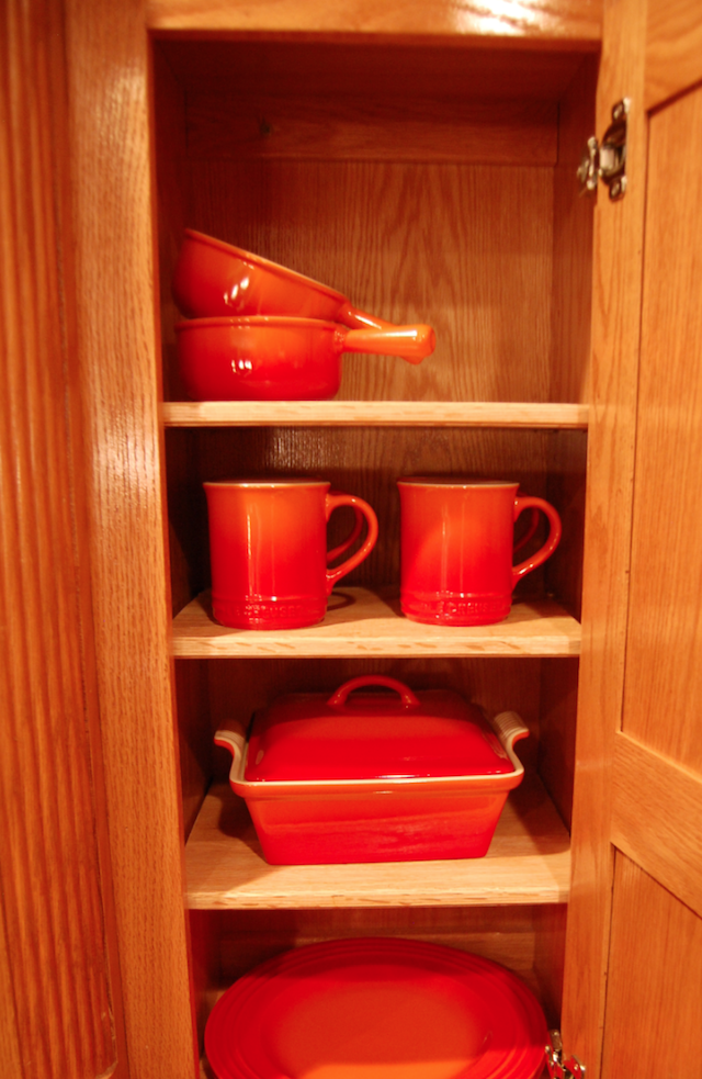 Le Creuset Flame Organized In Cabinet