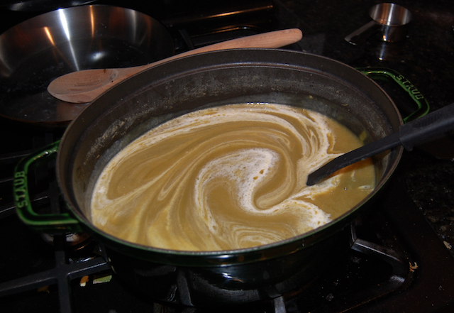 Stirring in a Few Tablespoons of Cream Into the Leek and Potato Soup