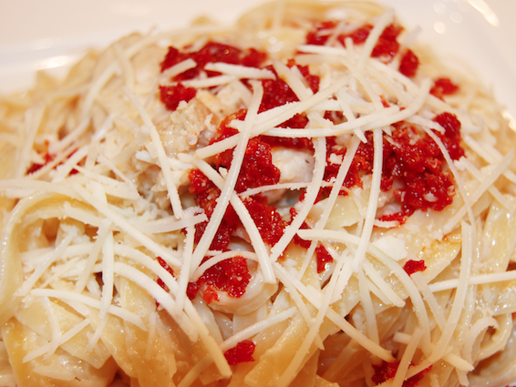 Cream and Butter Sauce with Romano Cheese Chicken and Sun Dried Tomato Closeup