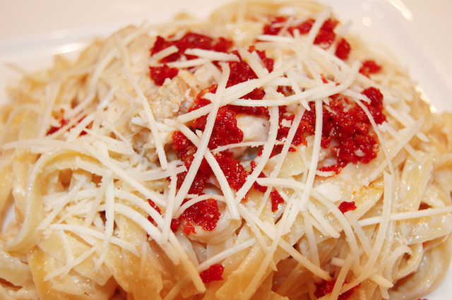 Cream and Butter Sauce with Romano Cheese Chicken and Sun Dried Tomato Closeup