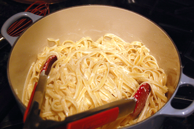 Tossing Alfredo Noodles with Cream Sauce