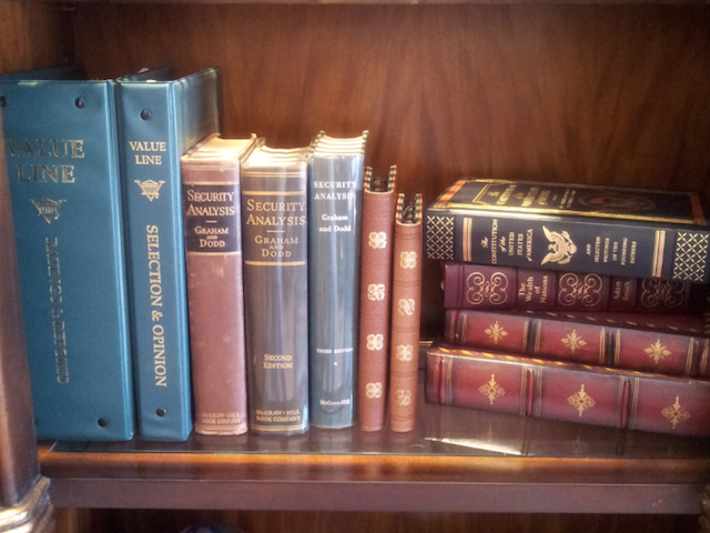 Kindle Paperwhite and Kindle Fire Next to Security Analysis on Bookshelf Joshua Kennon Kindle Paperwhite and Kindle Fire Next to Security Analysis on Bookshelf Joshua Kennon