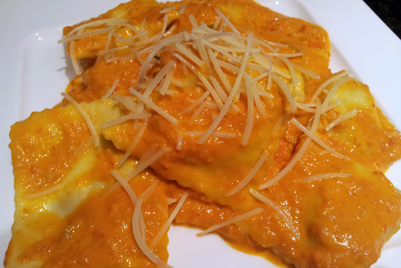 Tomato and Cream Sauce Over Stuffed Ravioli