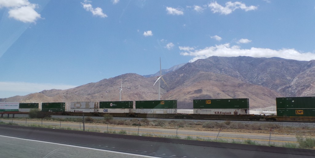 Double Stacked Trains and Windmills Driving Into Palm Springs