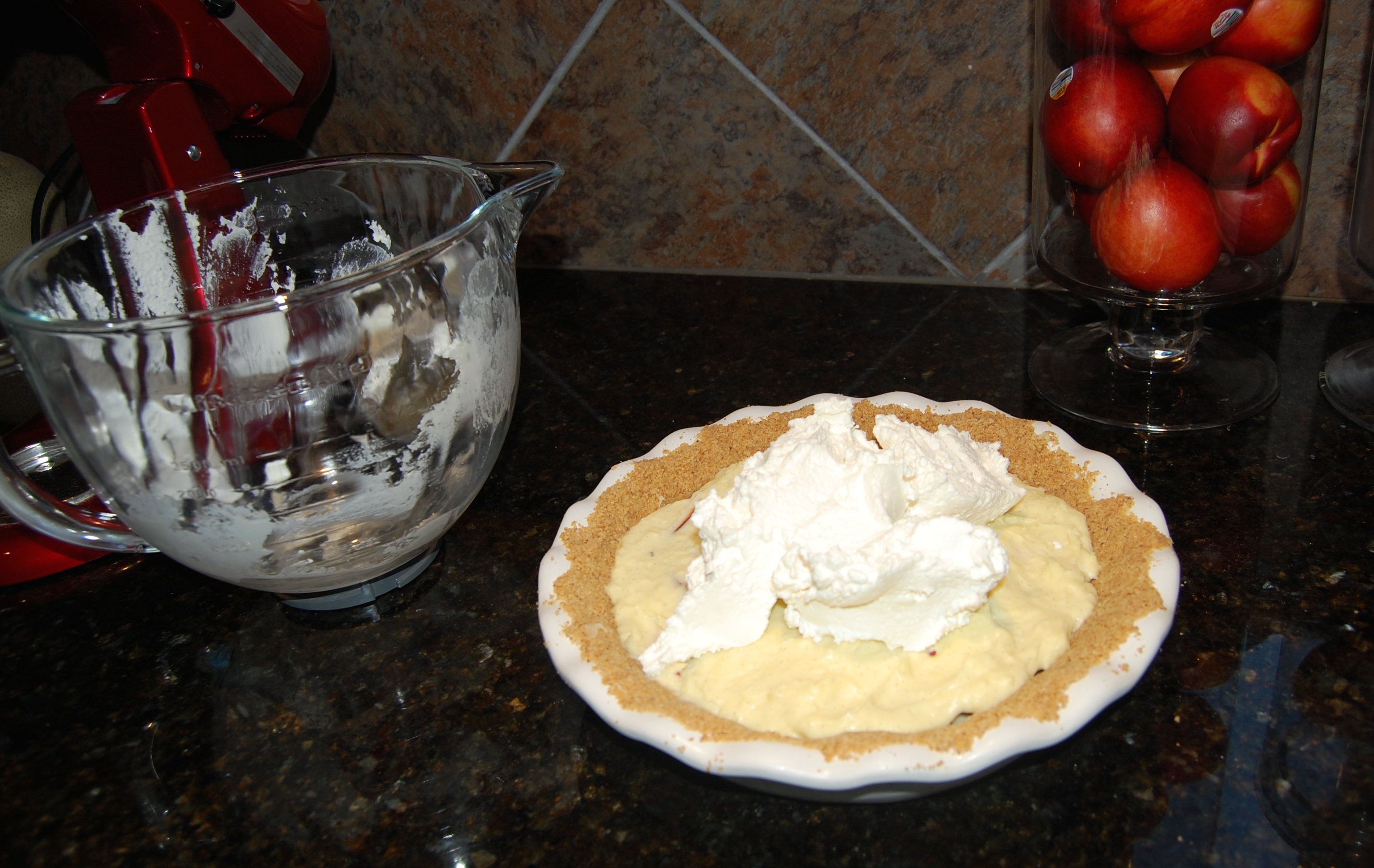 Spreading Whipped Cream on Nectarine White Chocolate Cream Pie