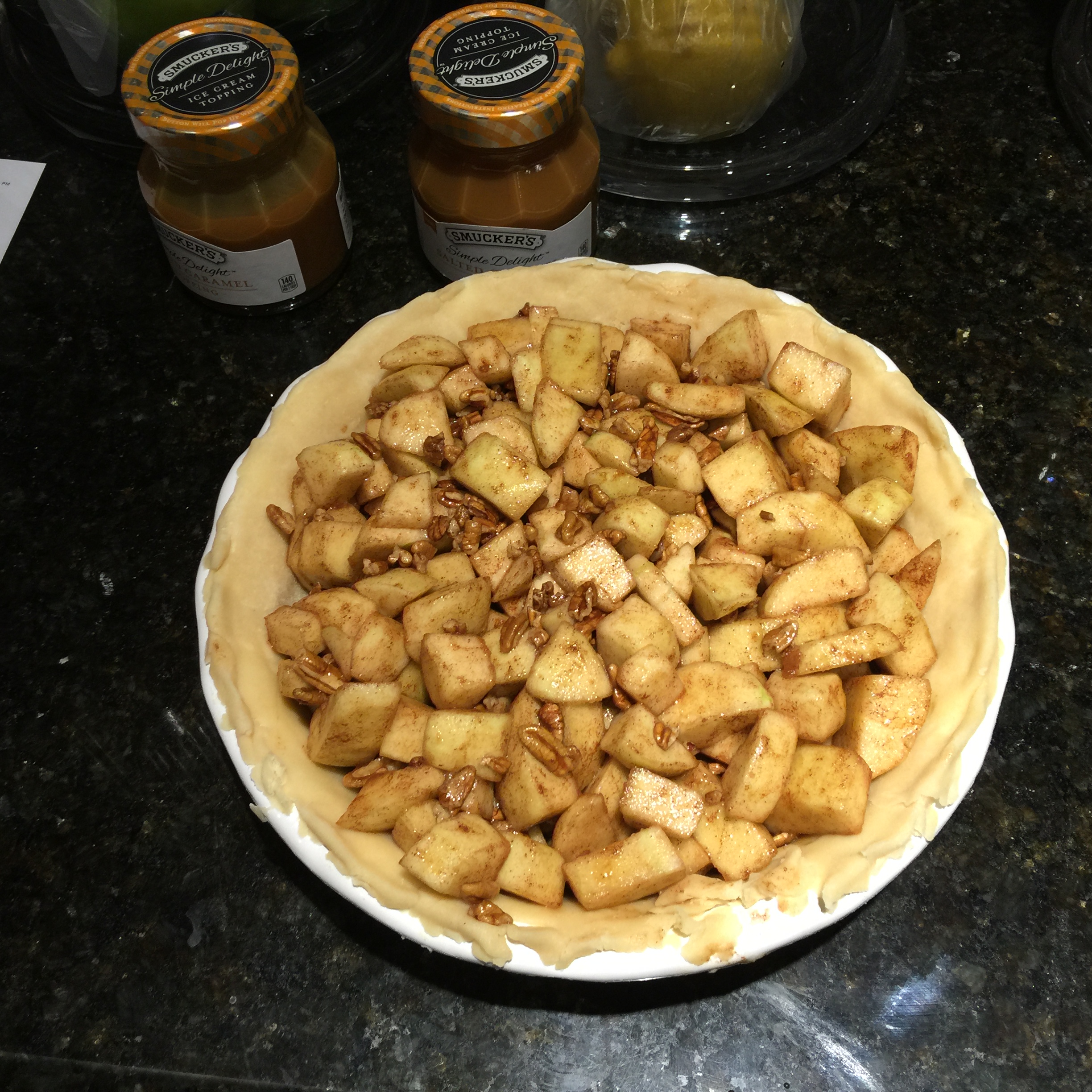 Filling in Caramel Apple Pie Crust Ready for Butter