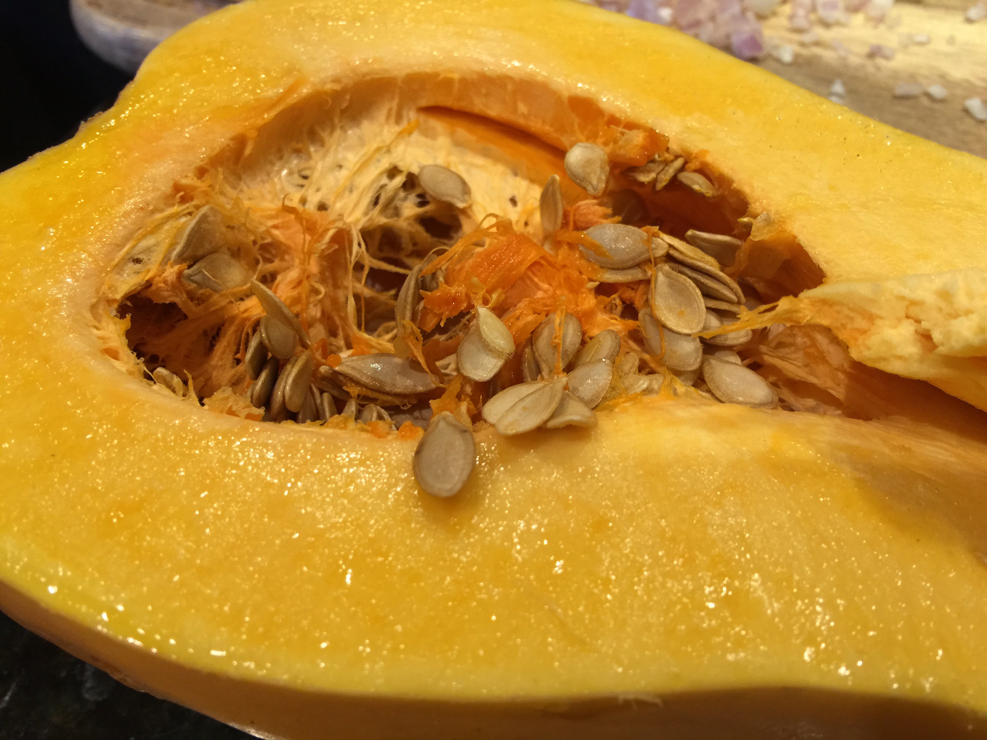 Scoop Out Seeds and Fibers of Butternut Squash