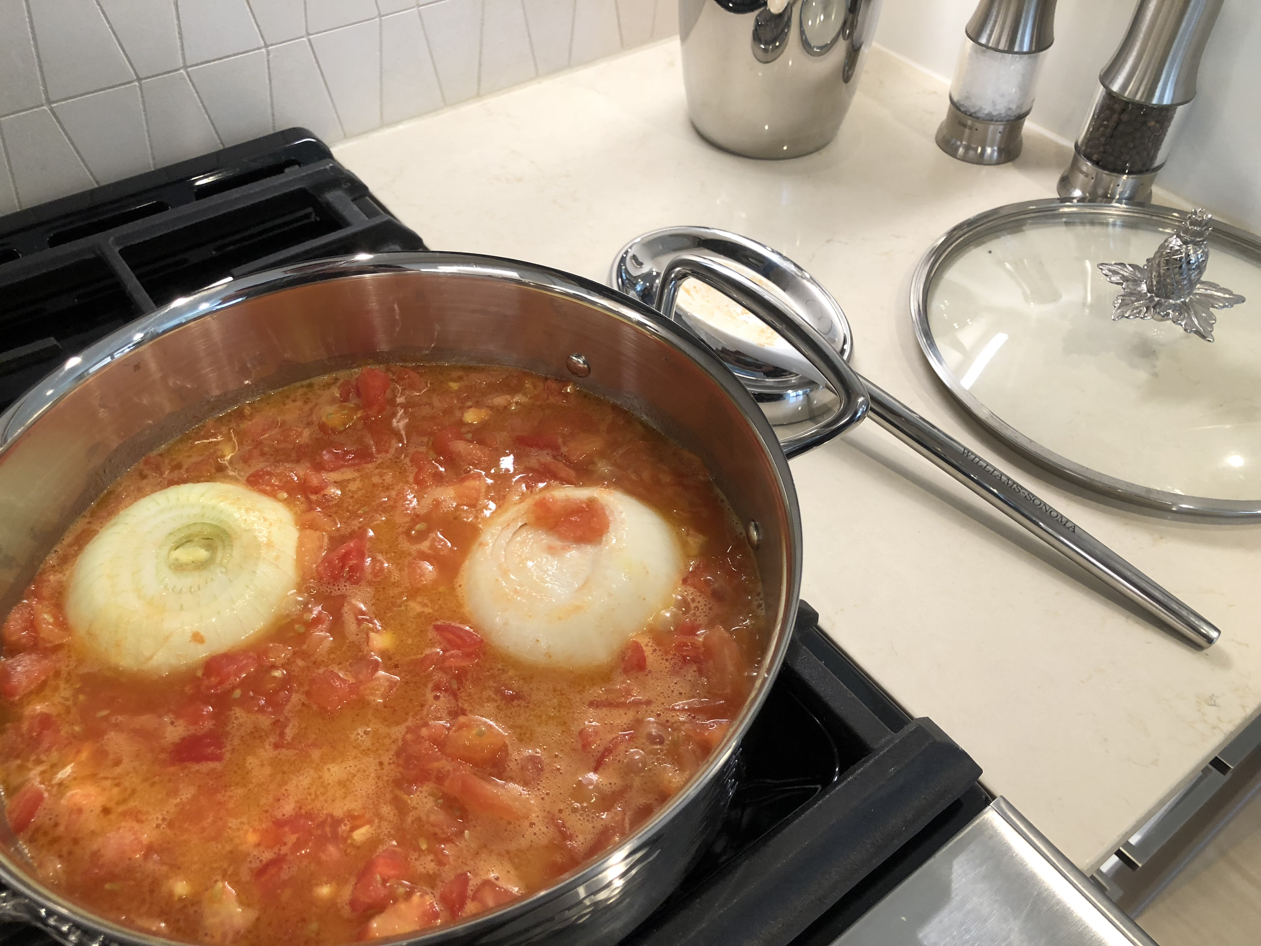Reducing the Tomato Sauce in Butter and Onion on the Stove