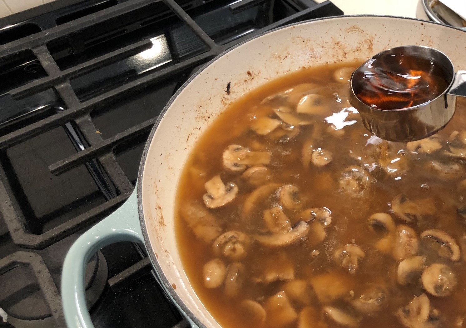 Adding One-Third Cup of Brandy to Beef Stroganoff