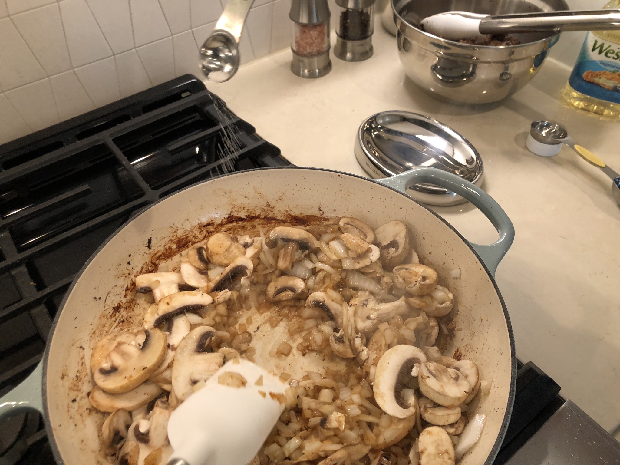 Salting the Oil, Onions, and Mushrooms for Beef Stroganoff