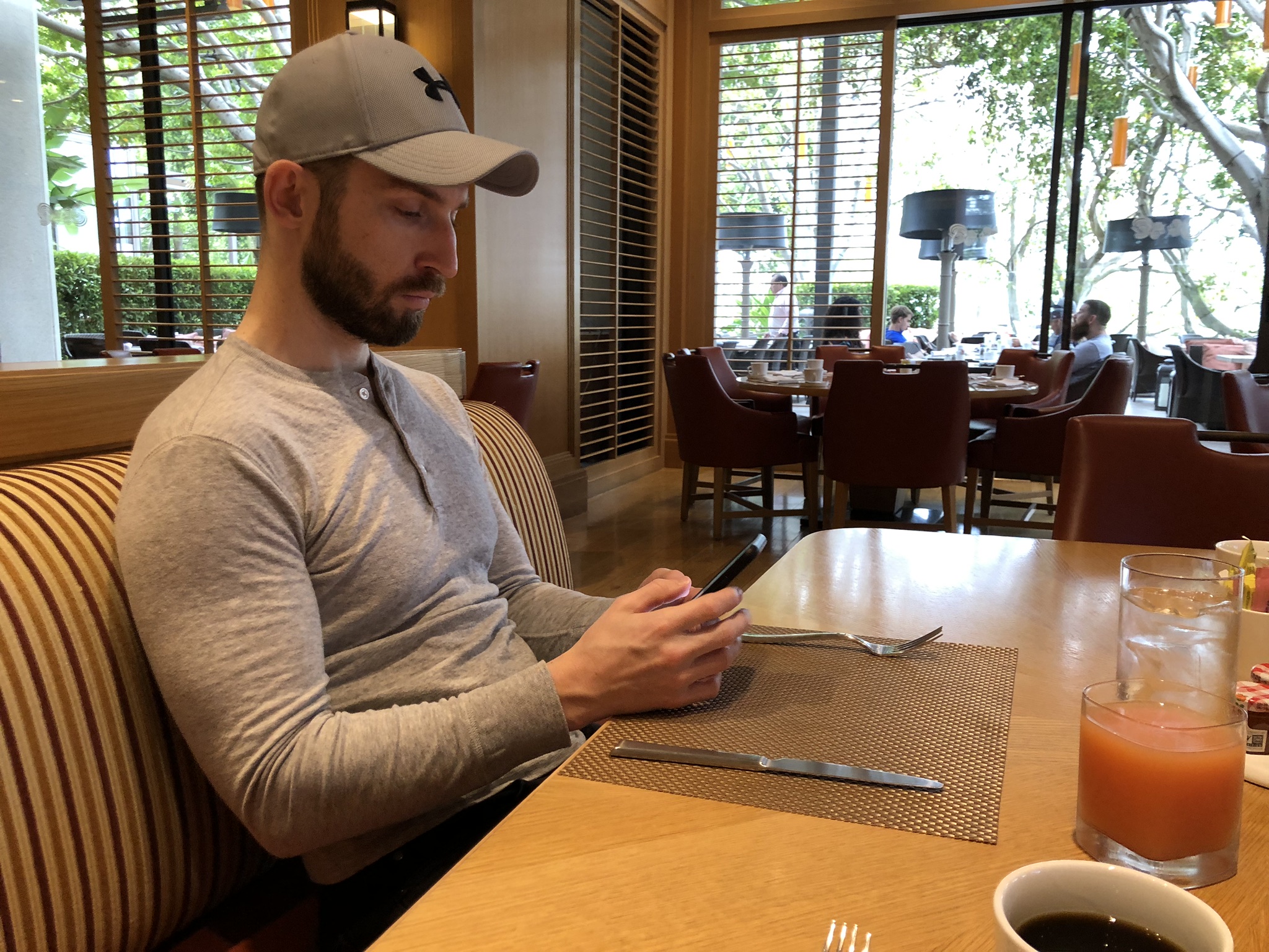 Aaron Reading at Oak Grill in Newport Beach Fashion Island Hotel with Grapefruit Juice