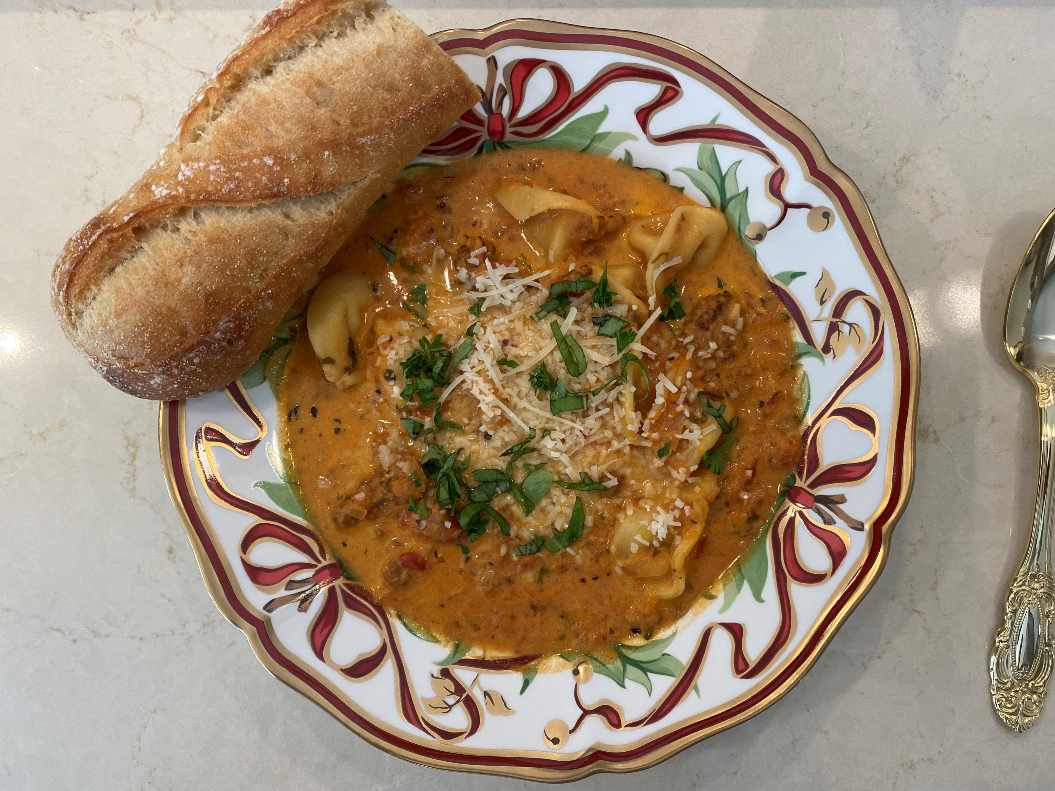 Having Finished Dutch Oven Tortellini Soup with Italian Sausage and Bread for Leftovers