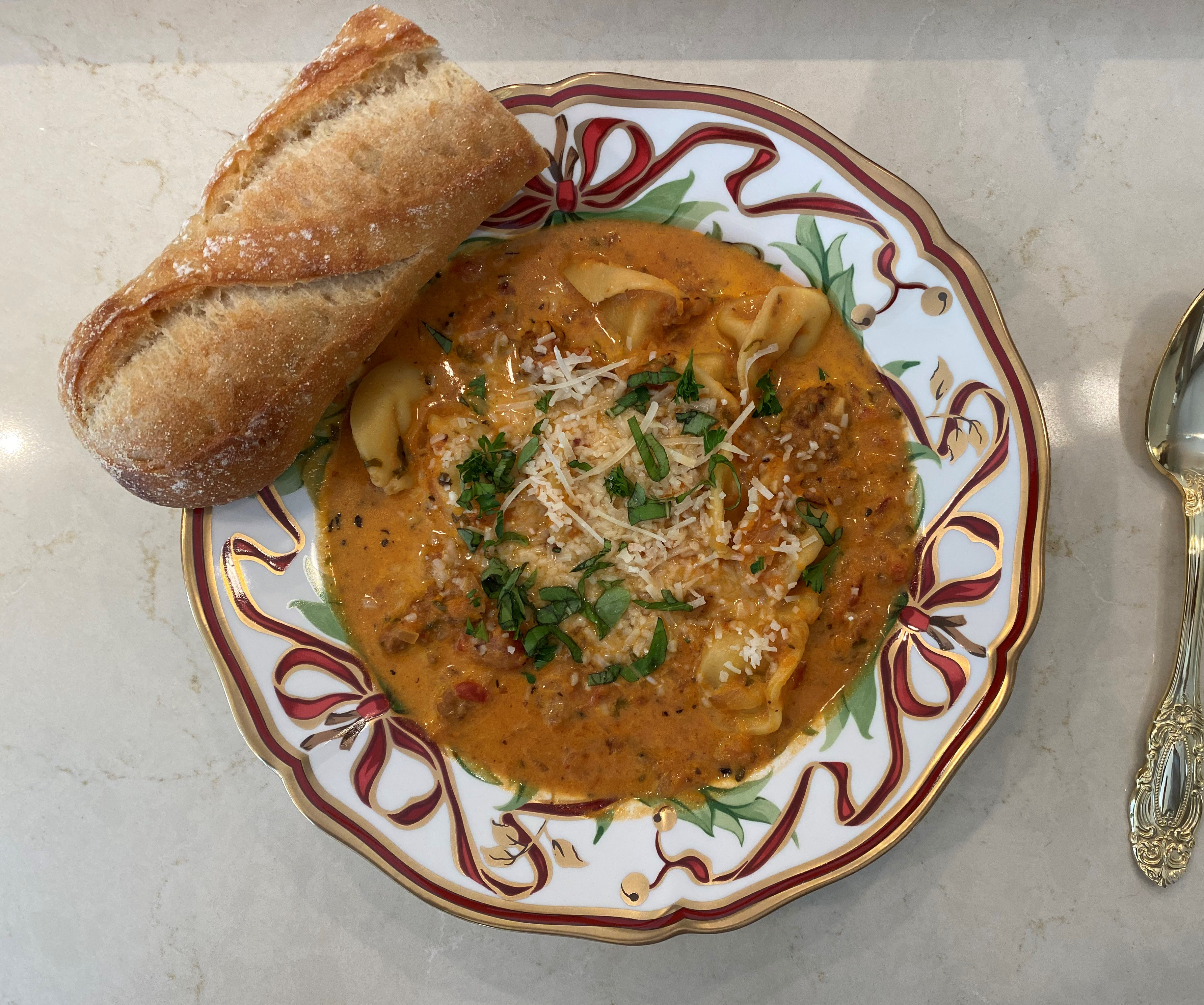 Having Finished Dutch Oven Tortellini Soup with Italian Sausage and Bread for Leftovers