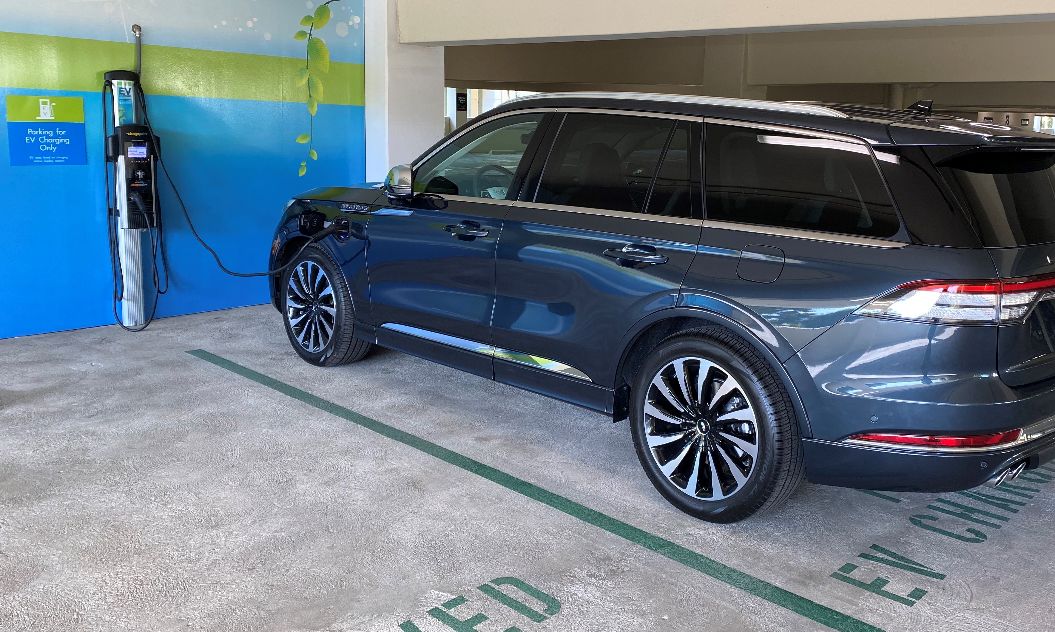 Charging Hybrid SUV in Office Parking Garage